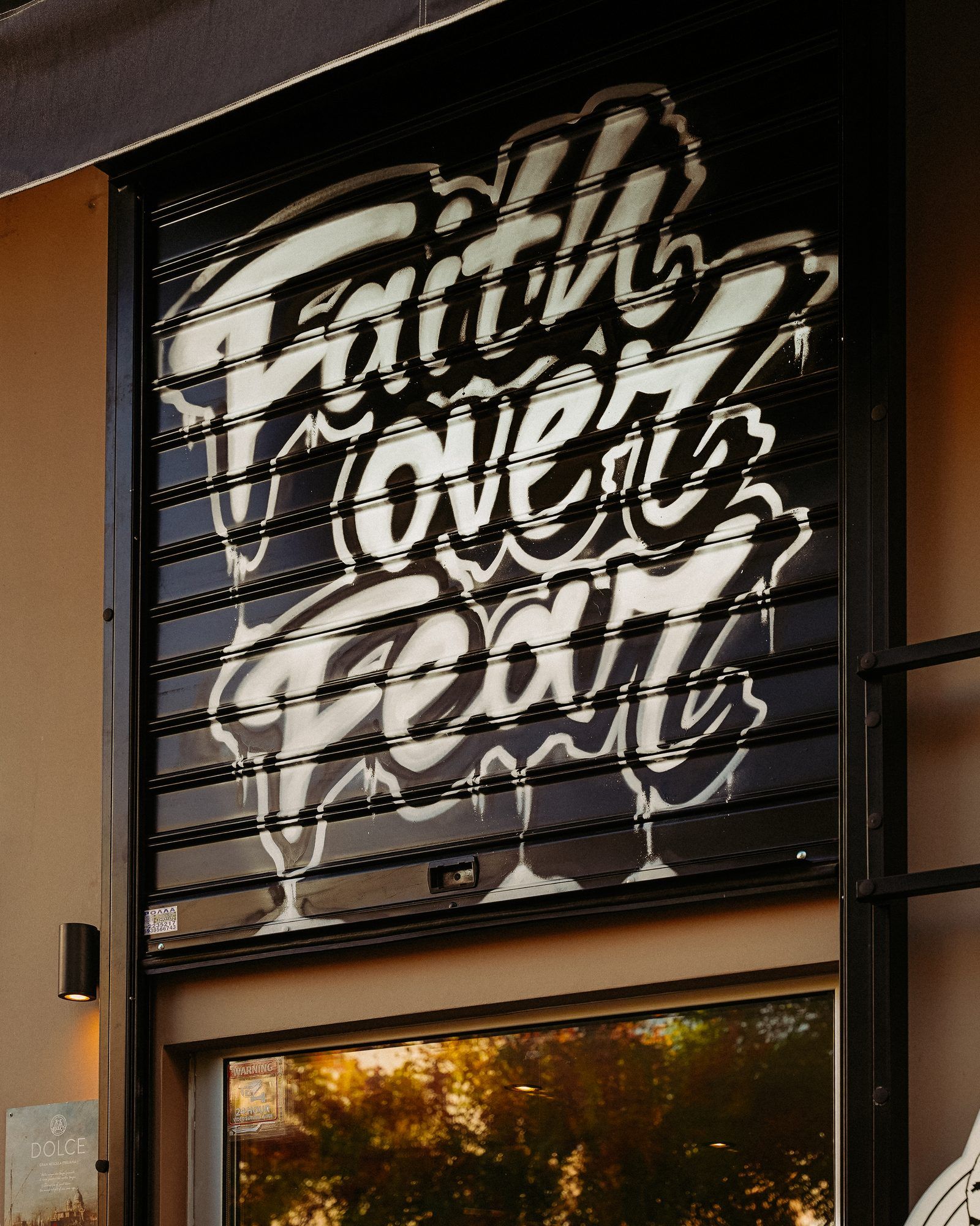 The shutter with the “Faith over fear” graffiti