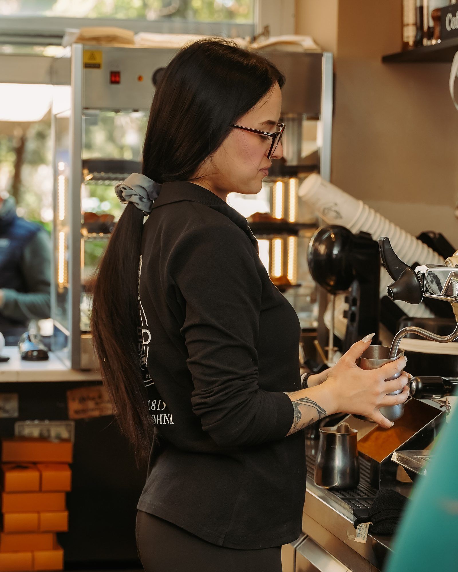 A Blessed barista at the espresso machine